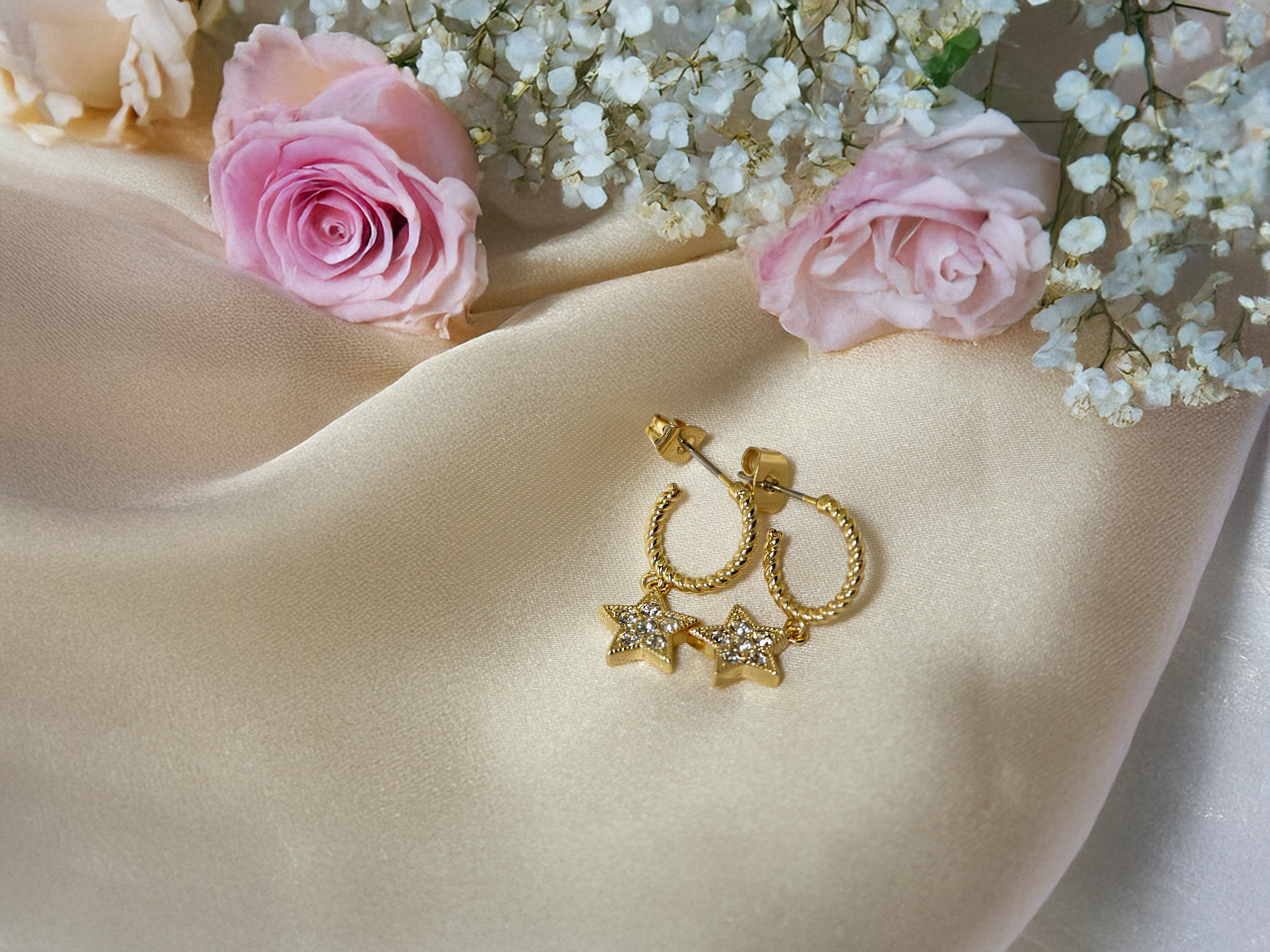 Iris star earrings clear