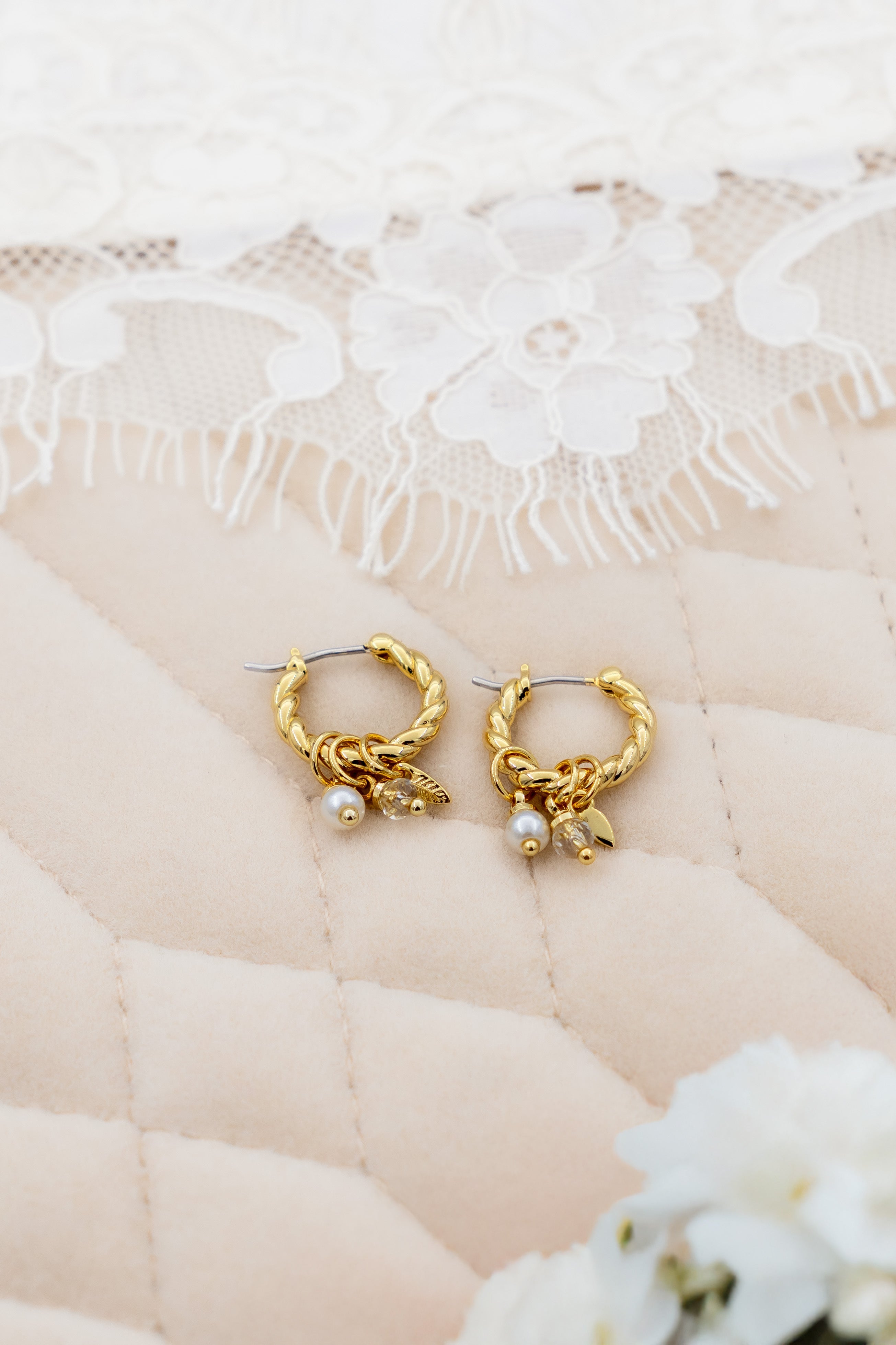 Lucente twisted charm hoops