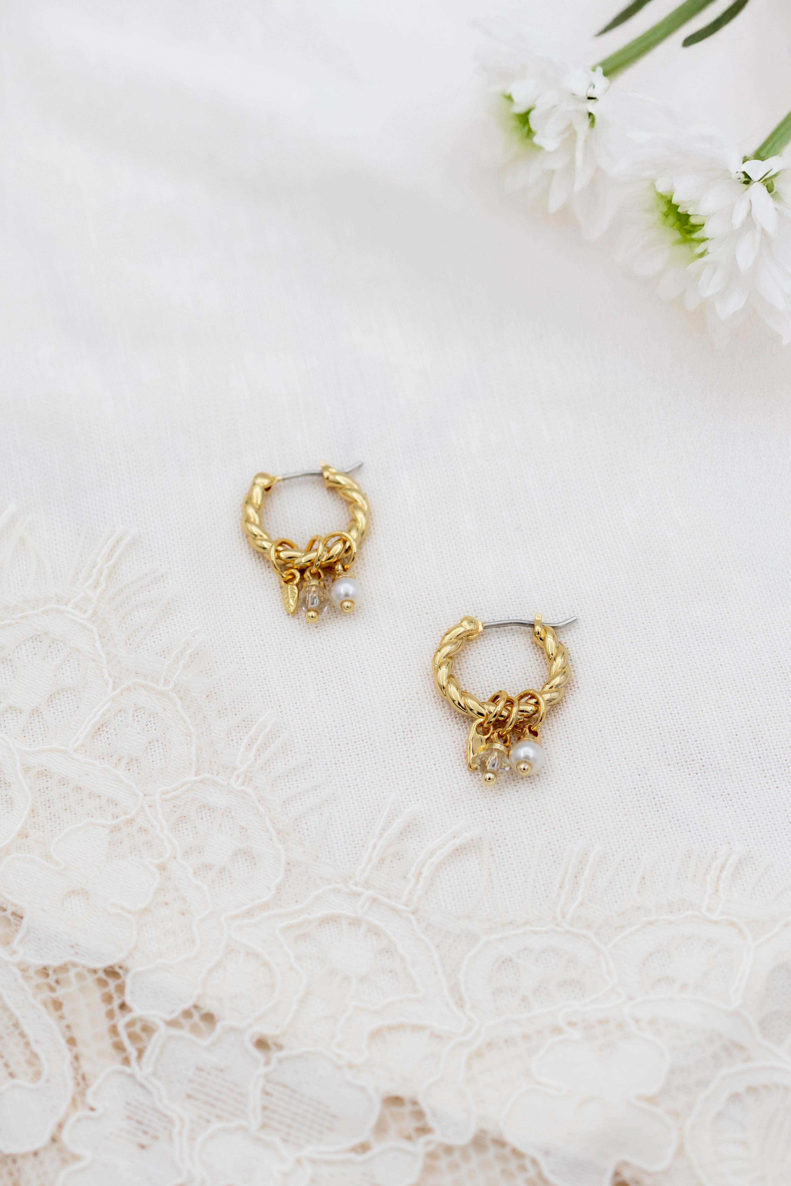 Lucente twisted charm hoops